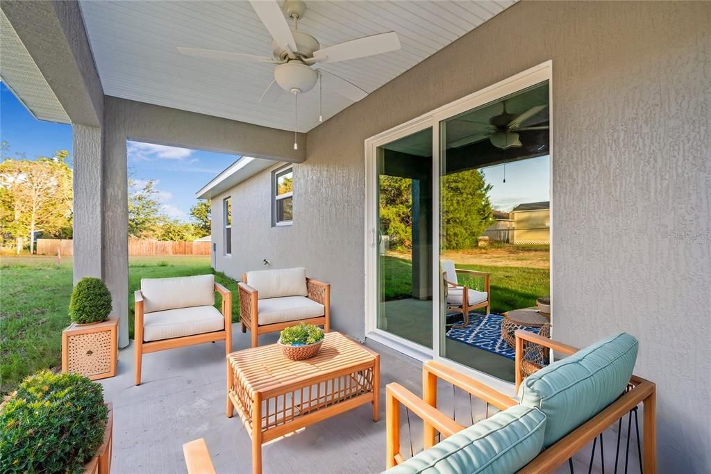 Virtually Staged - Covered back porch with fan