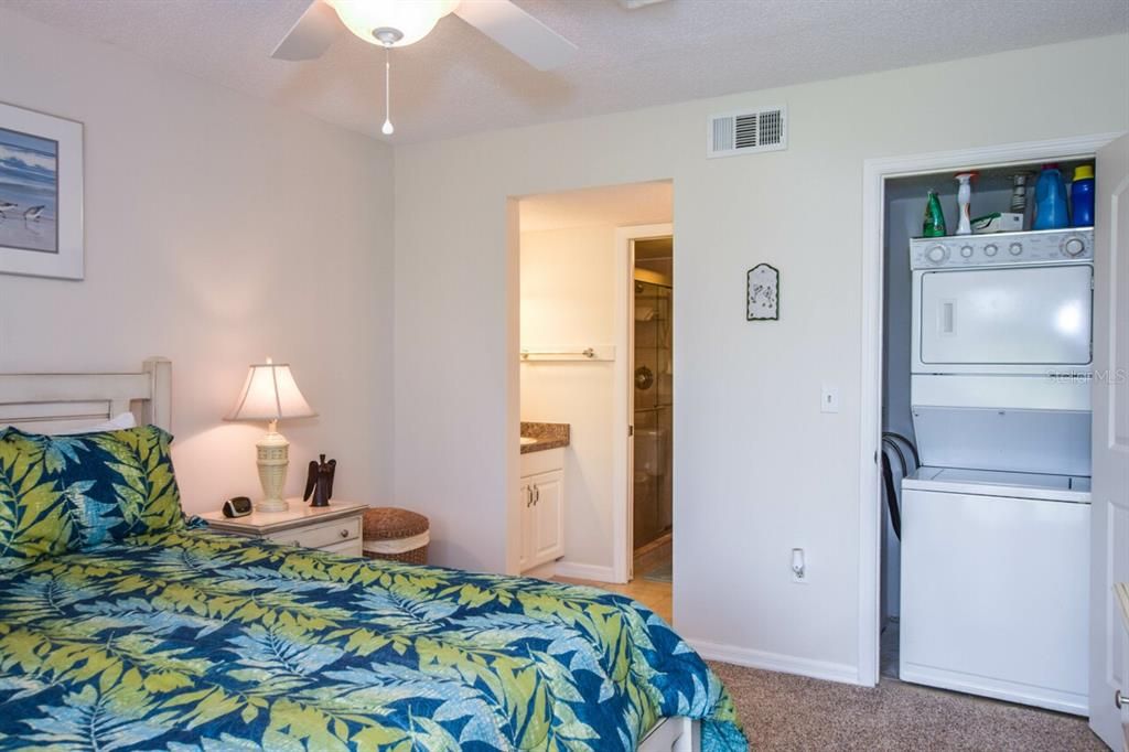 Primary bedroom with laundry closet