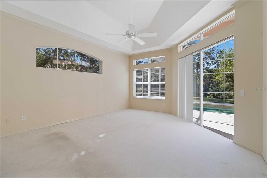 Main bedroom with sliding doors to the pool area