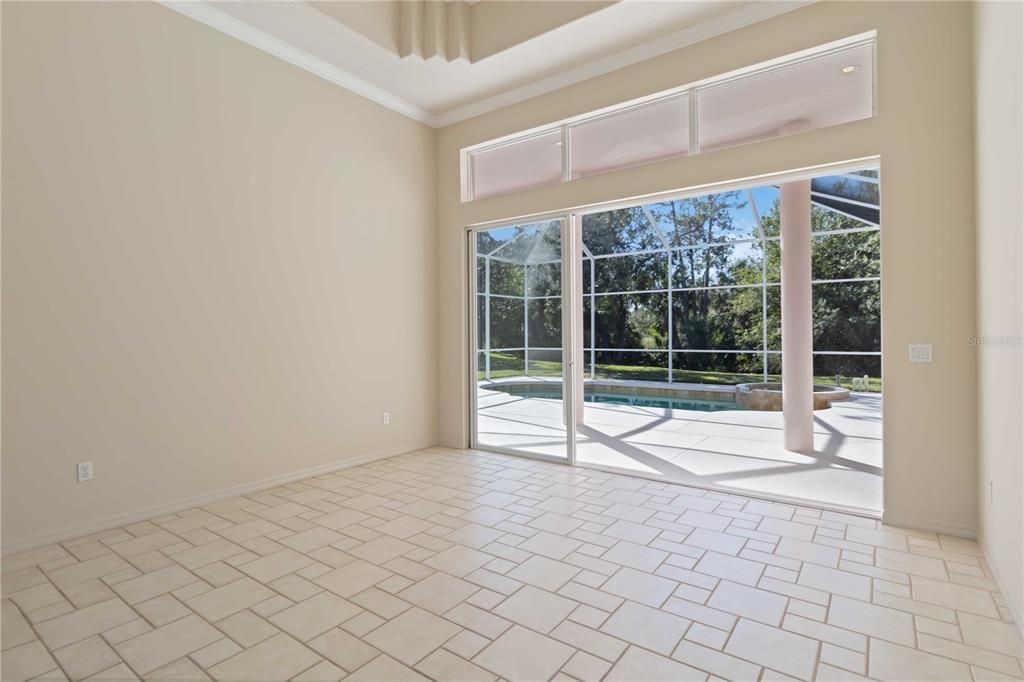 Living room with sliding doors opening to the pool area