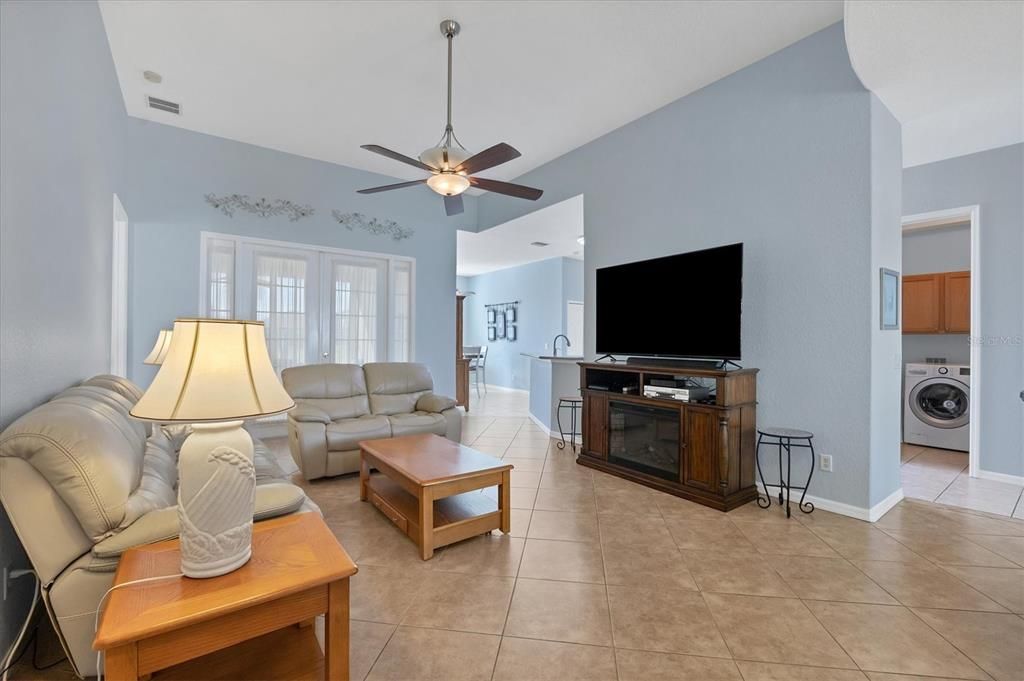 ANOTTHER VIEW OF GREAT ROOM, FRENCH DOORS AT REAR EXIT TO HUGE FLORIDA ROOM