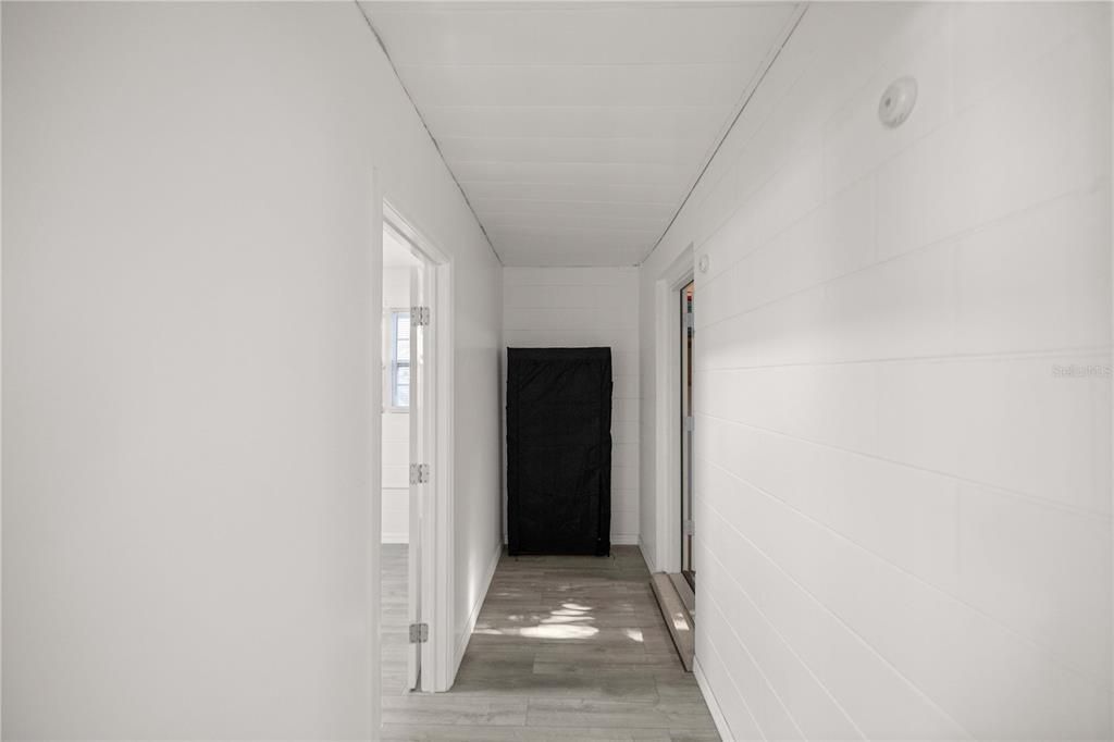 Hallway to utility room & flex space.