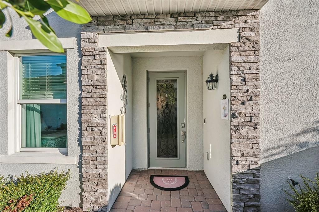 Lovely entrance for visitors with stacked stone.