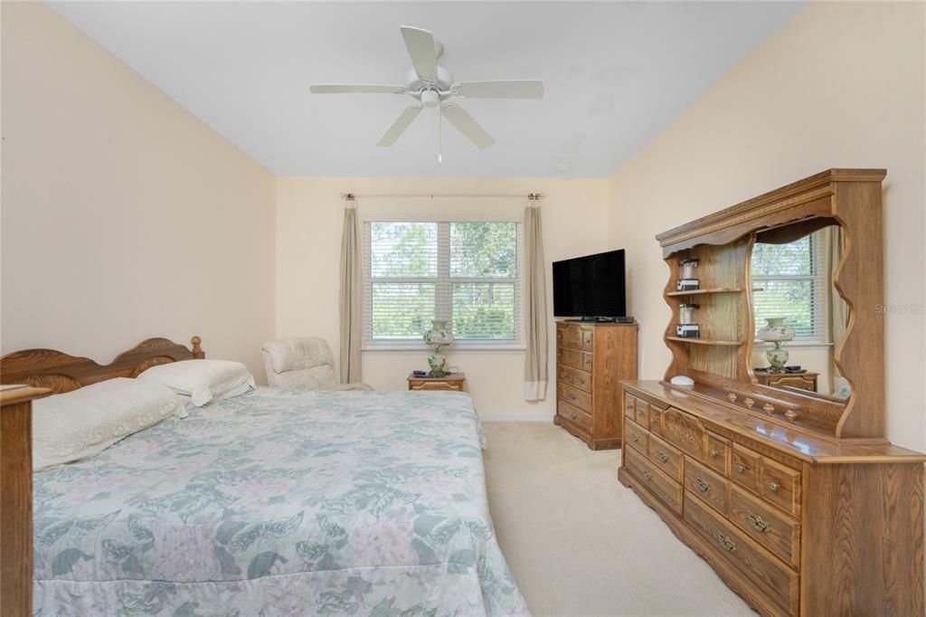 The master bedroom has plenty of space for your furniture and a large window for natural light.