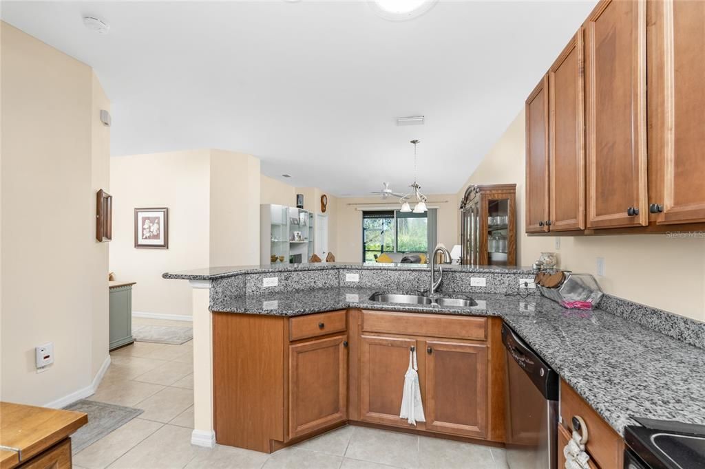 The kitchen has plenty of electrical outlets and nice stainless steel double bowl sink.