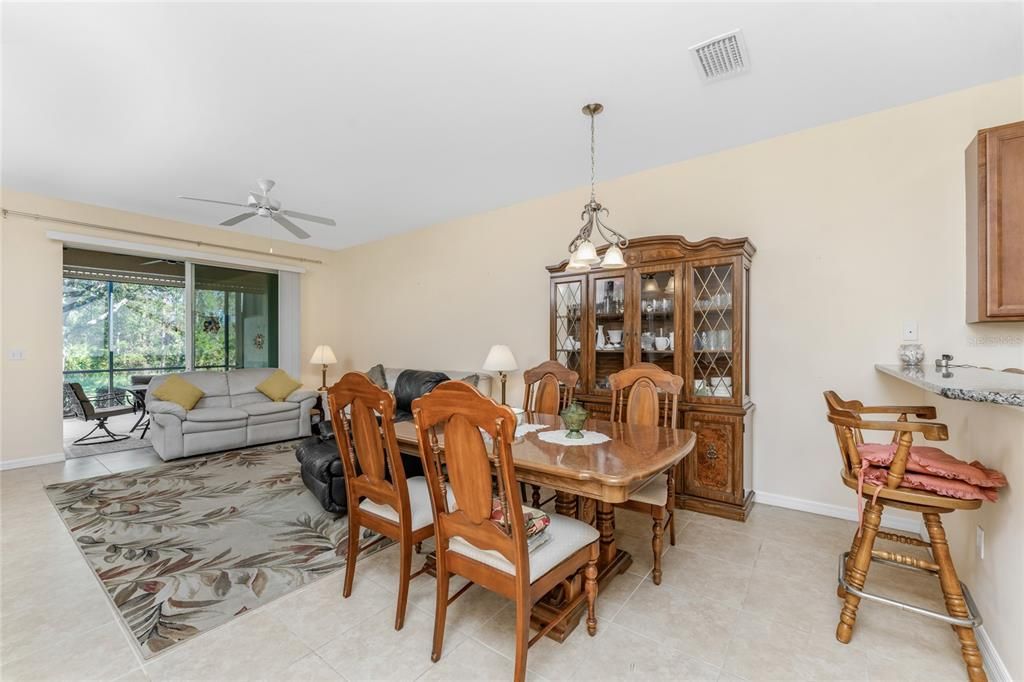 The dining area is conveniently located between the kitchen and living area.