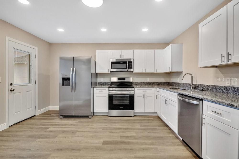 KITCHEN AND SIDE DOOR VIEW