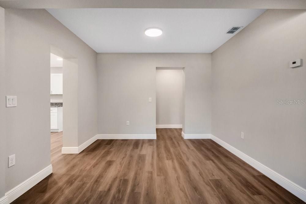 DINING ROOM AND VIEW OF HALLWAY THAT LEADS TO LAUNDRY ROOM