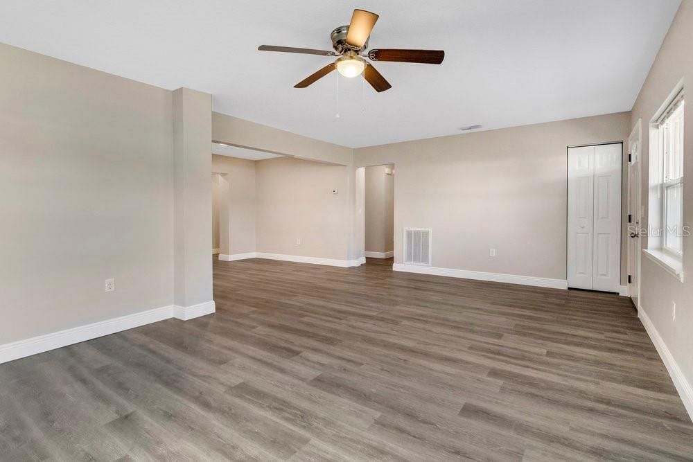 LIVING ROOM VIEW OF DINING ROOM AND COAT CLOSET