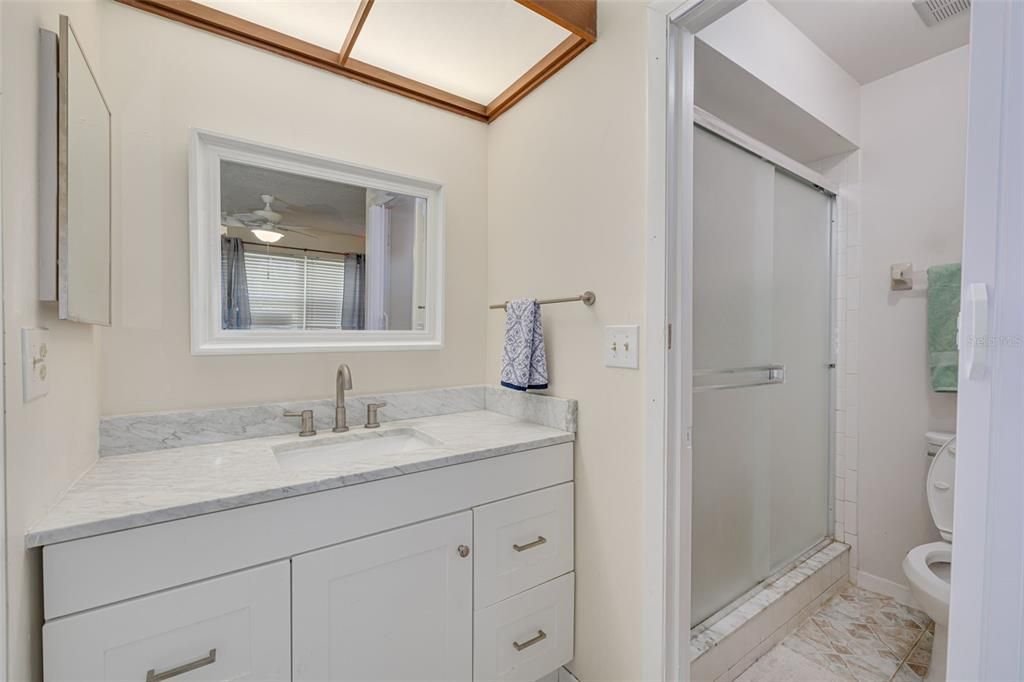 Primary bathroom with new commode and mirror!