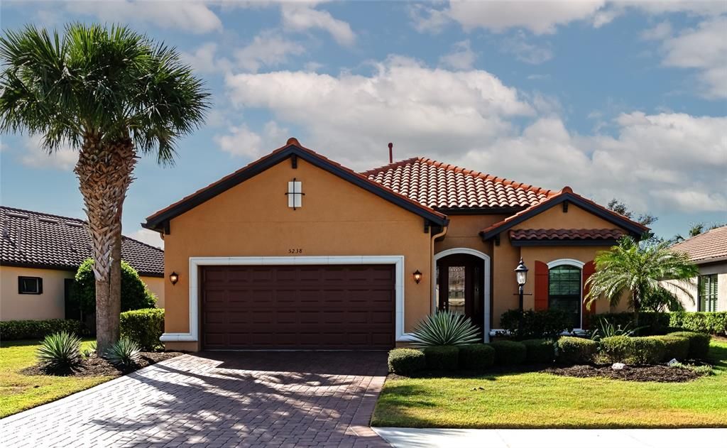 Just repainted exterior, brick paver driveway, tile roof