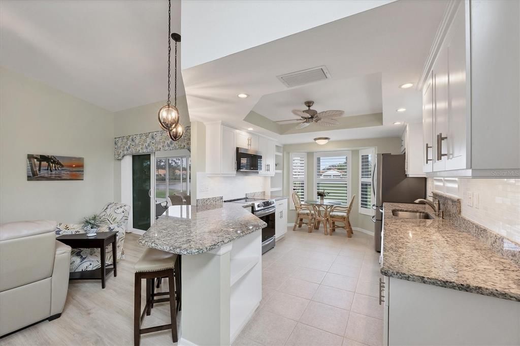 Counter height bar between kitchen and living room