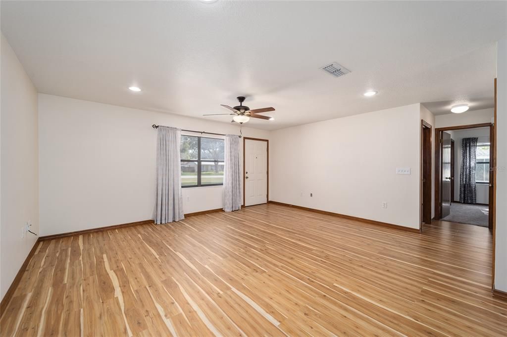 View to the living room with entrance to the bedrooms.