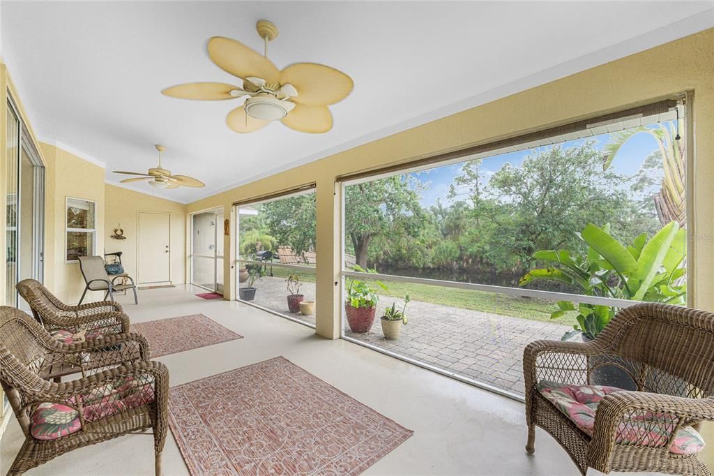 The spacious lanai features two ceiling fans and outdoor shower.