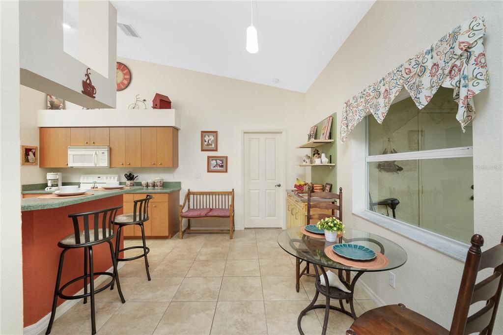 View of the breakfast bar and nook area.