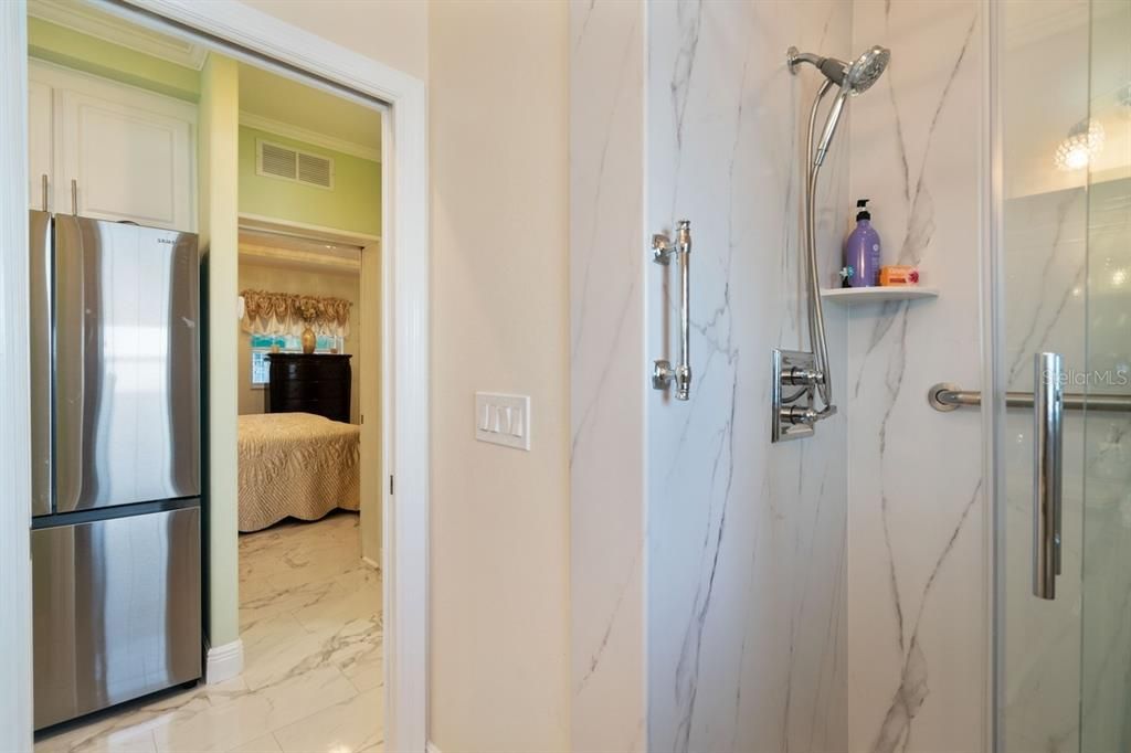 cultured marble shower in primary bathroom