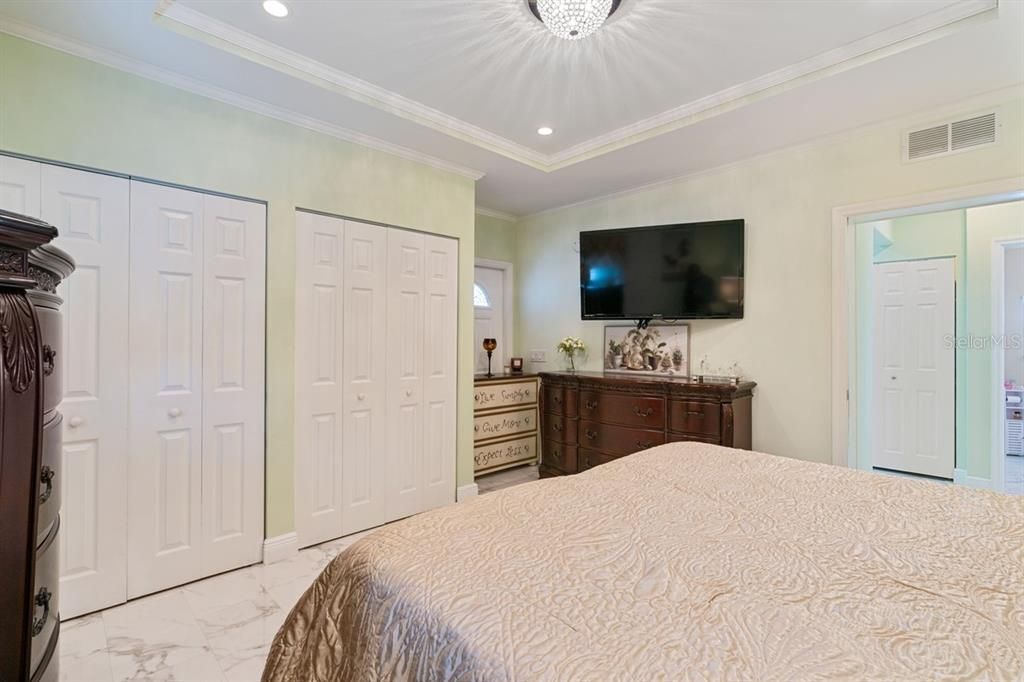 primary bedroom with his and hers closets