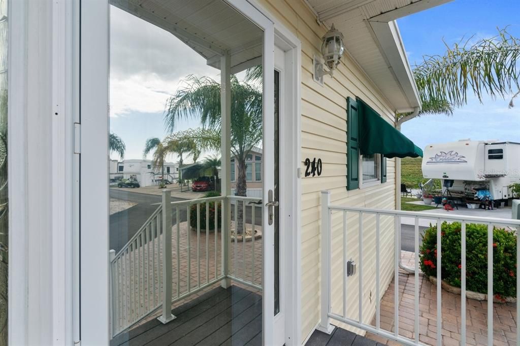 mirrored glass storm door at main entrance