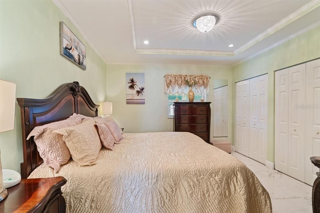 primary bedroom with his and hers closets