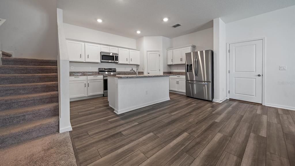 Kitchen with stairway to upstairs