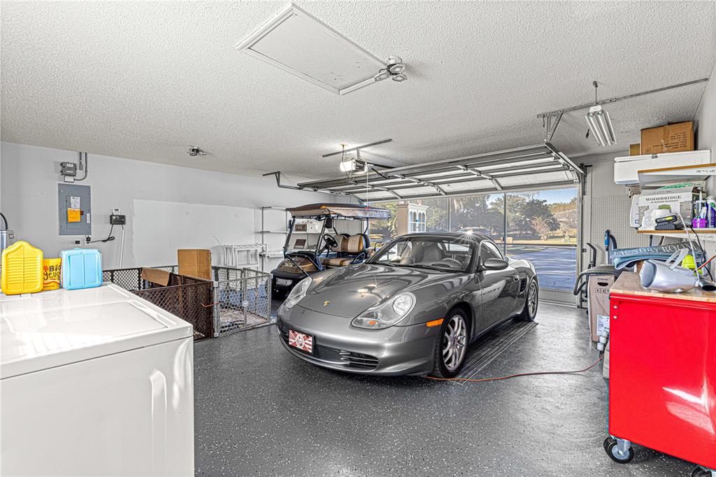 oversized garage with privacy screens and epoxy floor