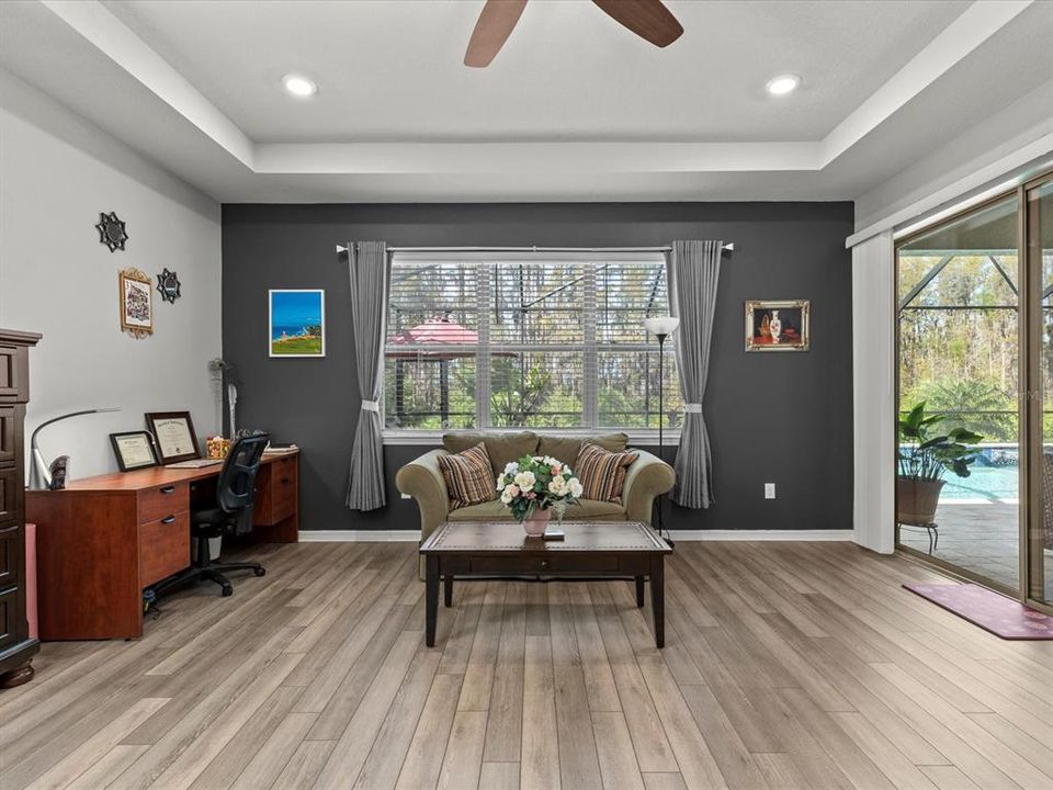 primary bedroom with lanai/pool access