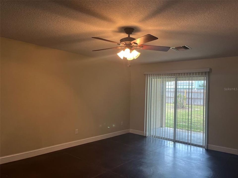 LIVING ROOM OPEN TO COVERED PATIO