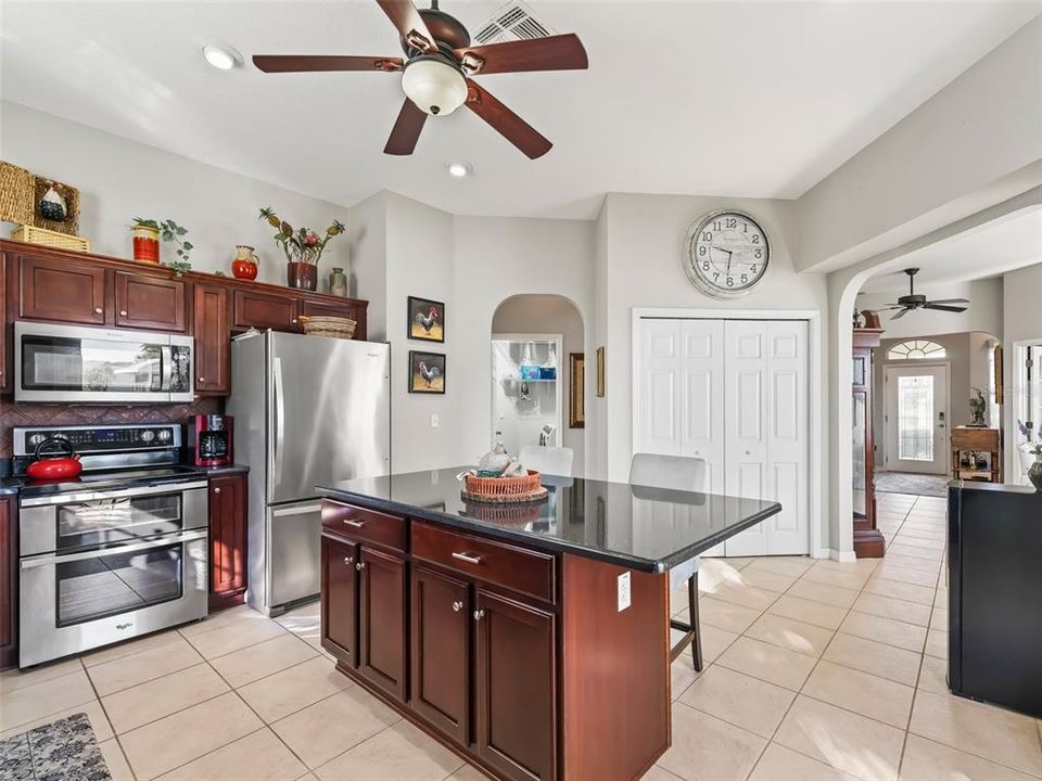 Kitchen w/Pantry closet & Rich wood cabinets