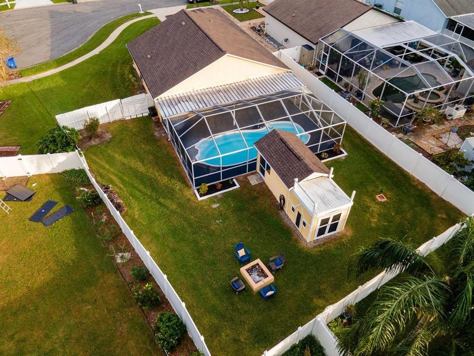 View of fully fenced back yard, new roof and pool