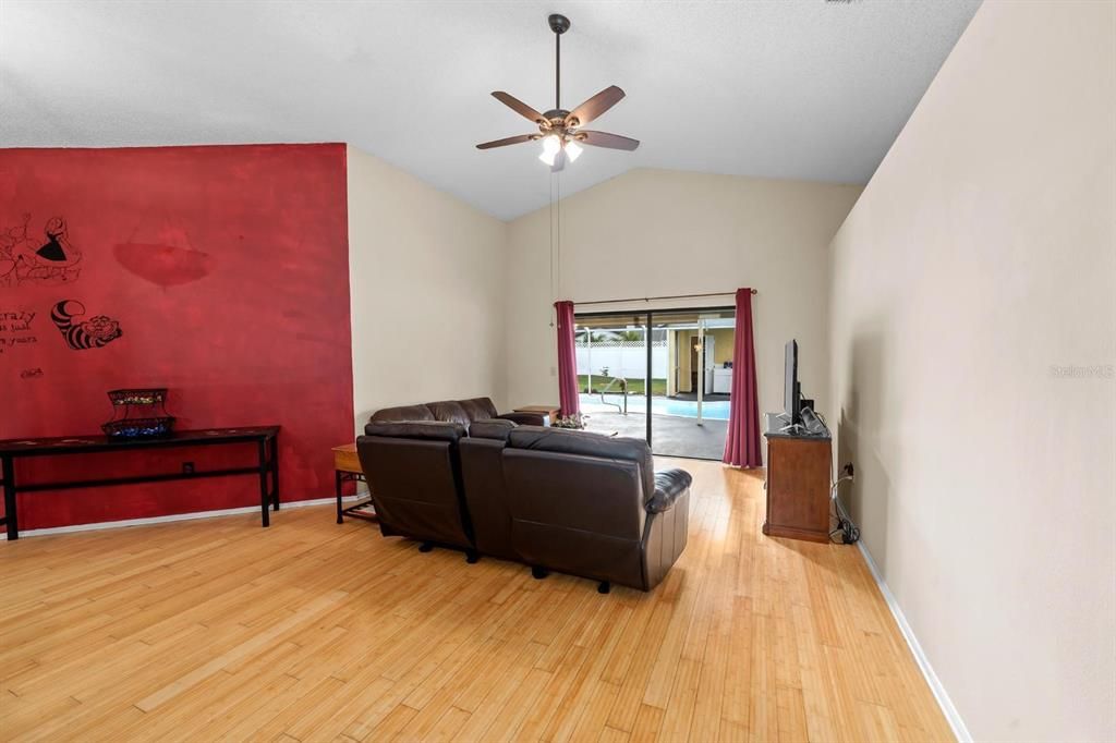 family room with sliders to the pool