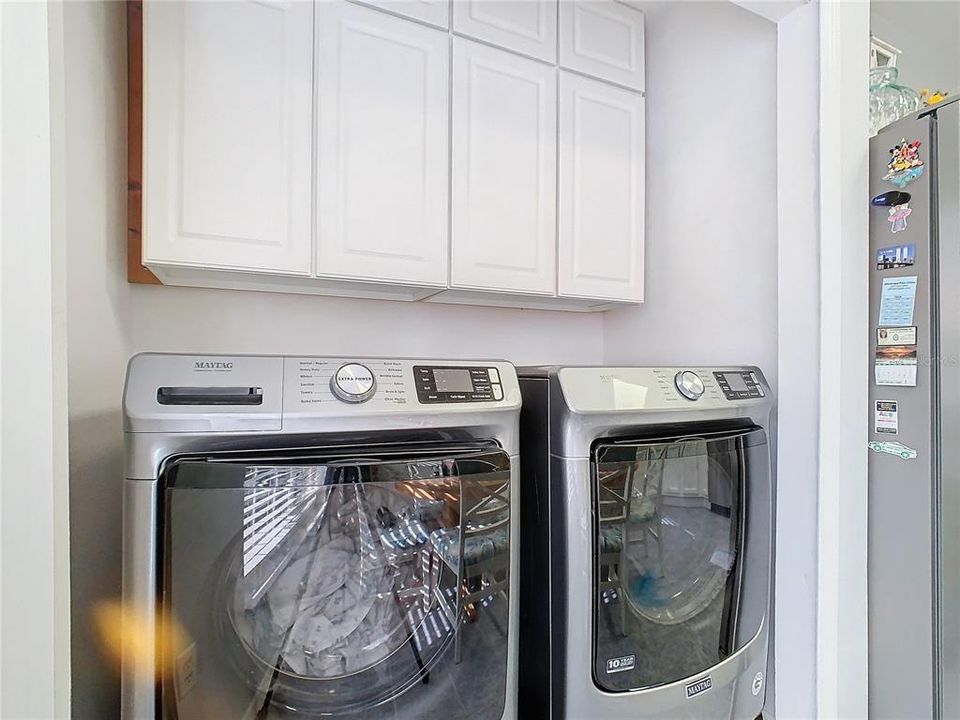 Inside Laundry area with cabinets!!