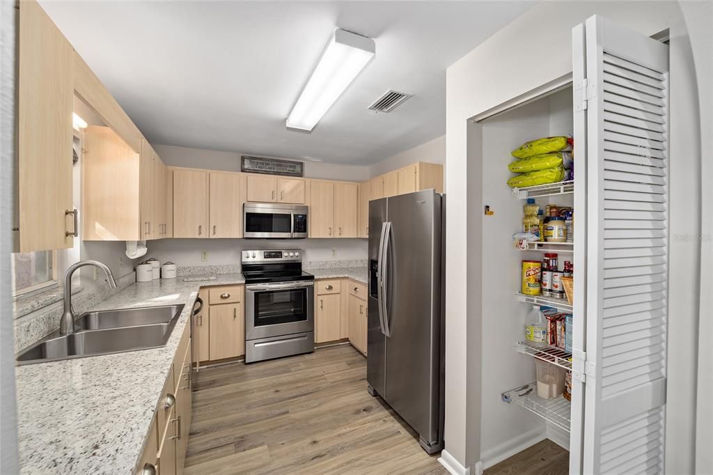 granite counter tops and a large pantry.