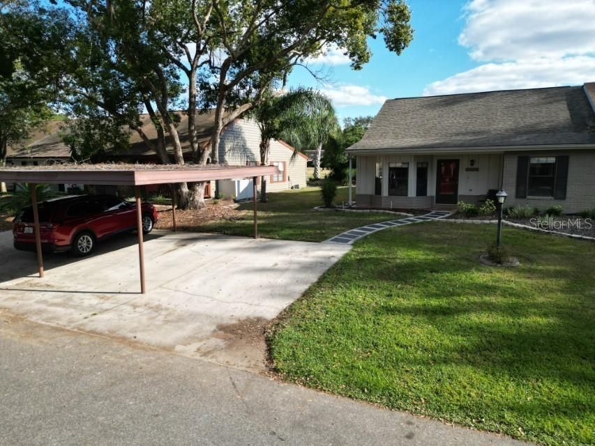 ONE COVERED CARPORT & ONE GUEST