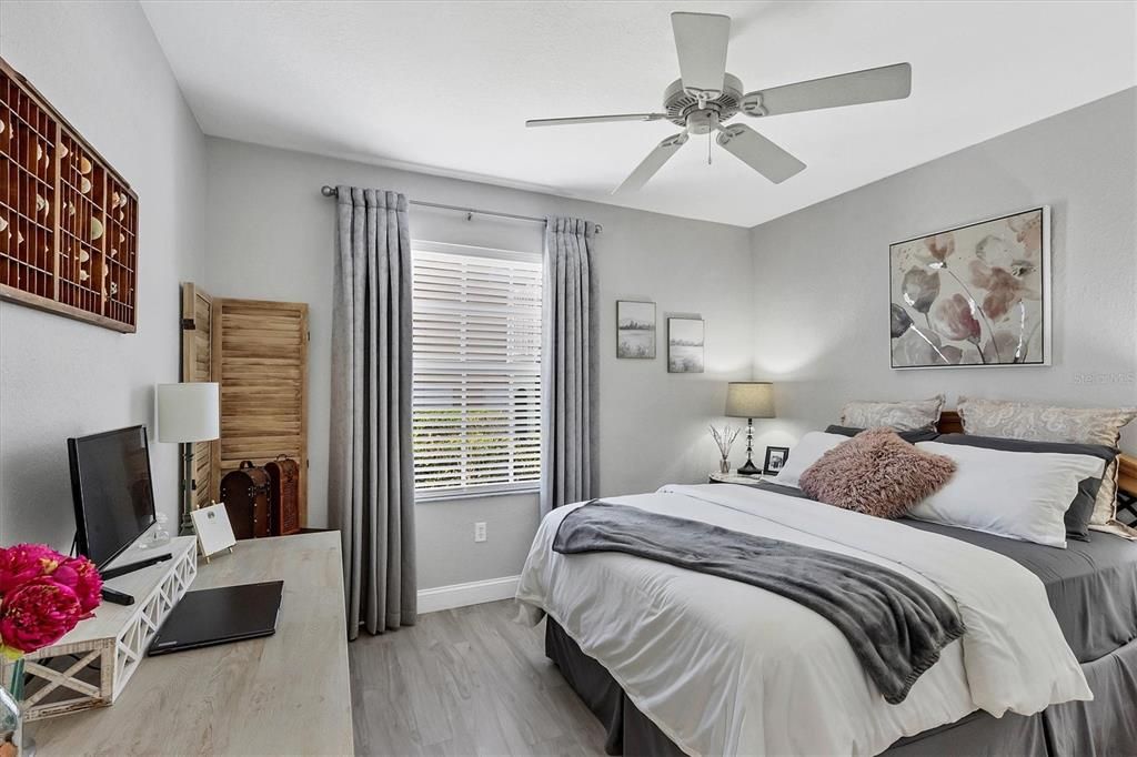 Light and Bright Guest Bedroom Featuring Luxury Vinyl