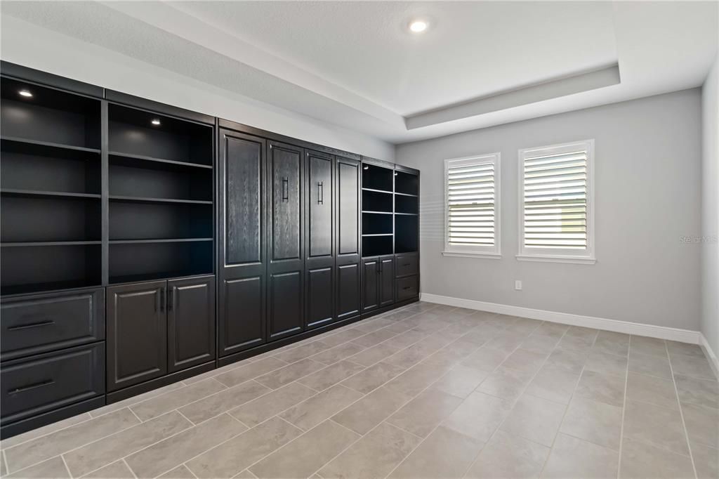 Second Living Space with Built-in Cabinets and Murphy Bed