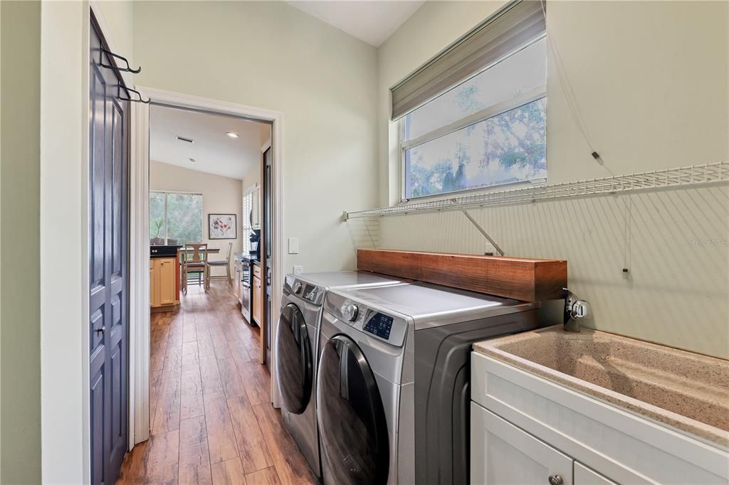 Full laundry room with a large drop sink.