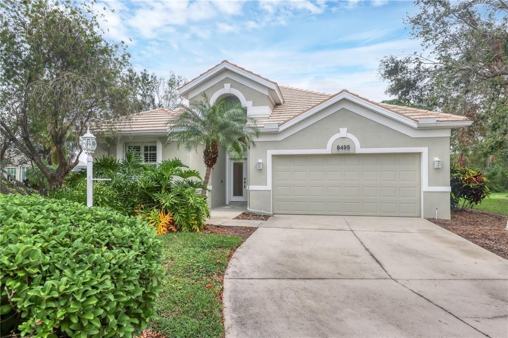 Front elevation showing the beautiful Florida landscaping