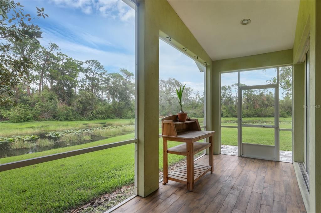 Screened-in lanai leads to the extended patio