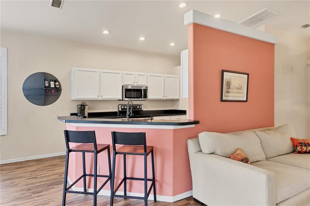 Kitchen Includes a breakfast bar for small meals or extra seating space.