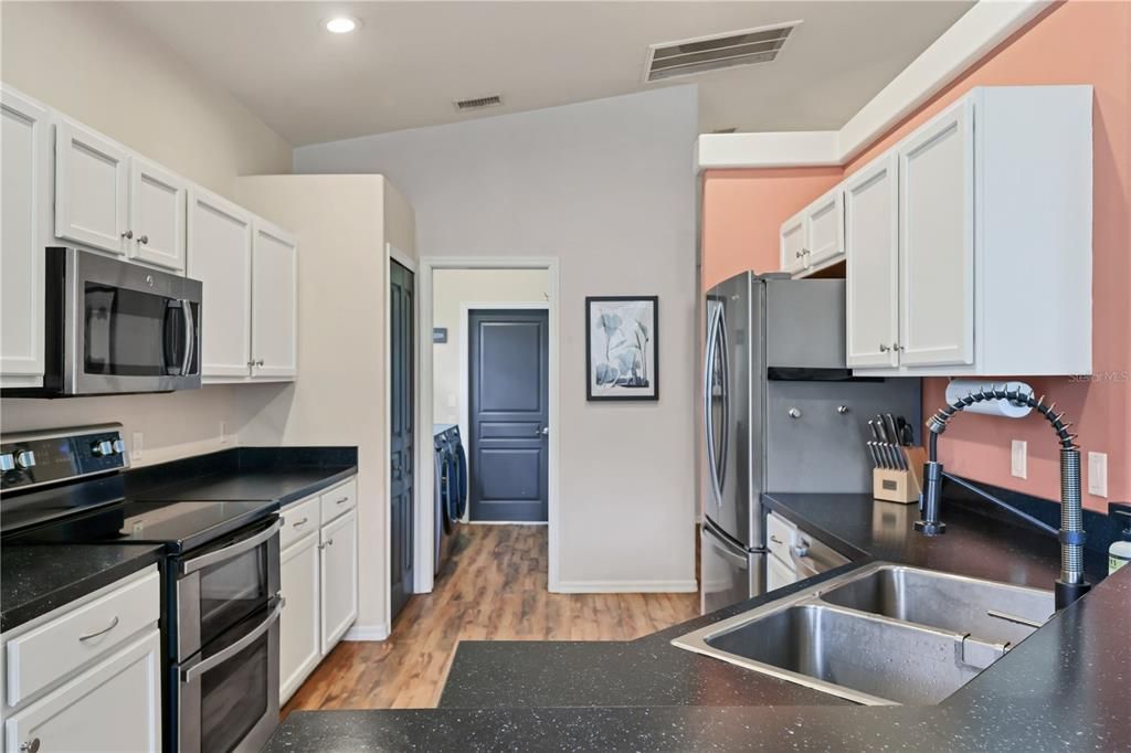 Kitchen includes ample counter space and cabinetry.