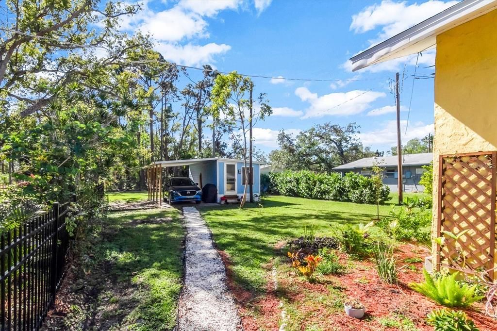 Back yard path to carport and workshop.