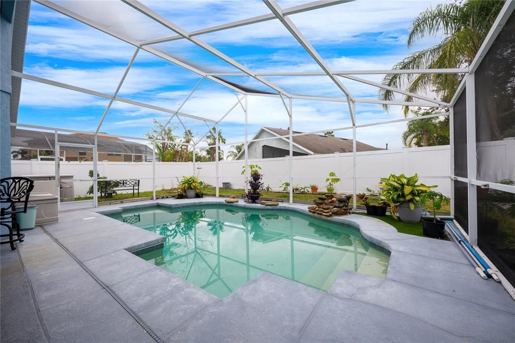 Spend weekends hosting family cookouts or relaxing poolside under the covered lanai, the lanai and pool overlook a FULLY FENCED BACKYARD for added privacy.