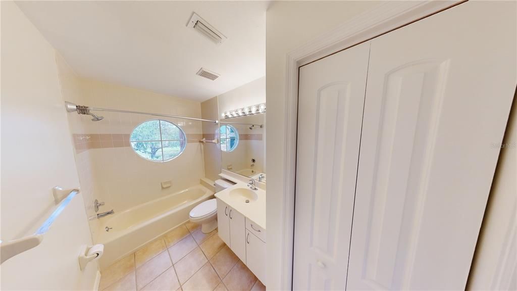 2nd Floor Full Bathroom with a linen closet.