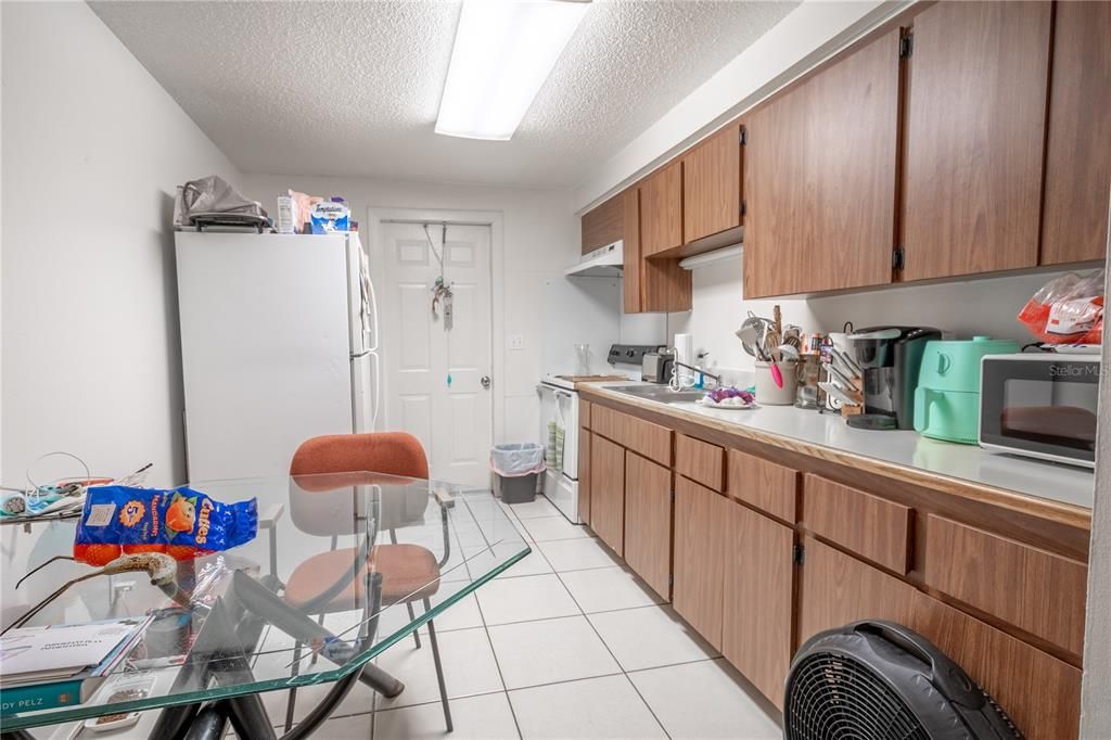 UNIT A Features ceramic tile flooring, plenty of cabinet and counter space.