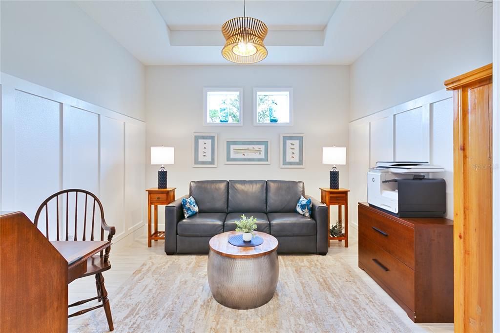 Den/Office/Bonus Room with tray ceiling.