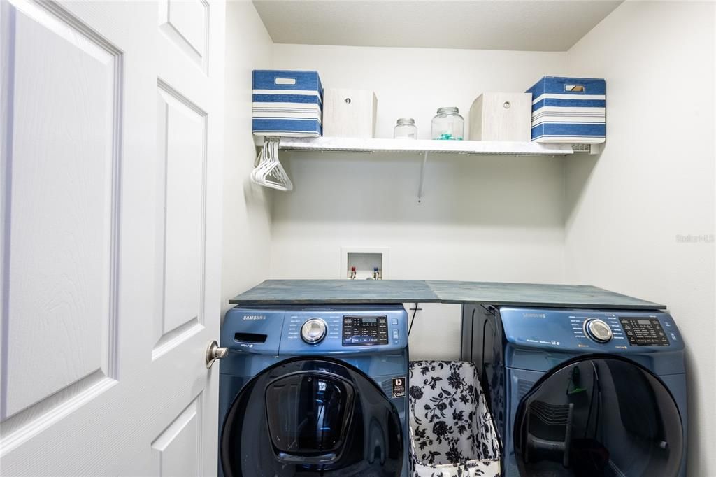 Laundry room with storage.