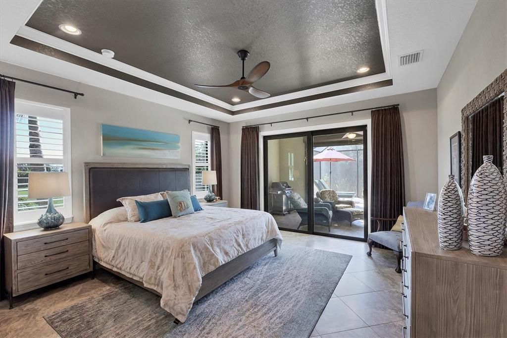 Master Bedroom with Sliders to Pool Screened Lanai!