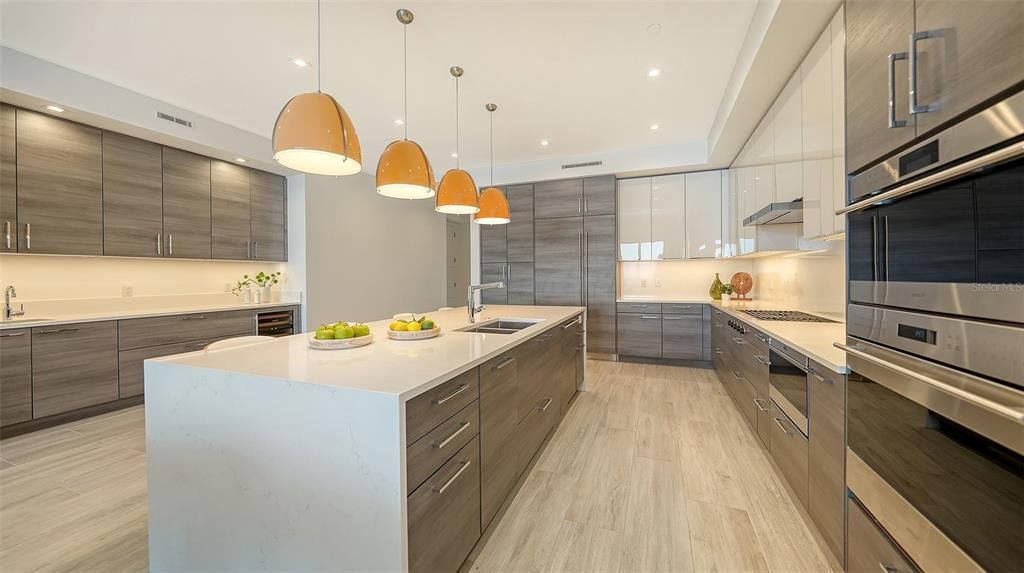 Clean lines with Quartz waterfall counters & separate bar with wine fridge