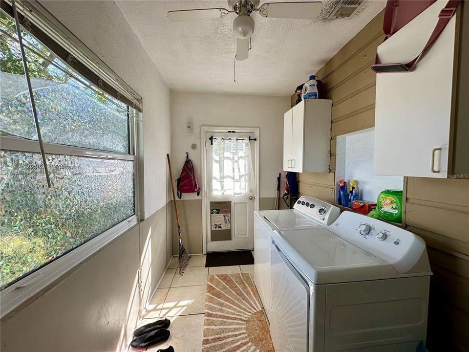 Large laundryroom with access to backyard