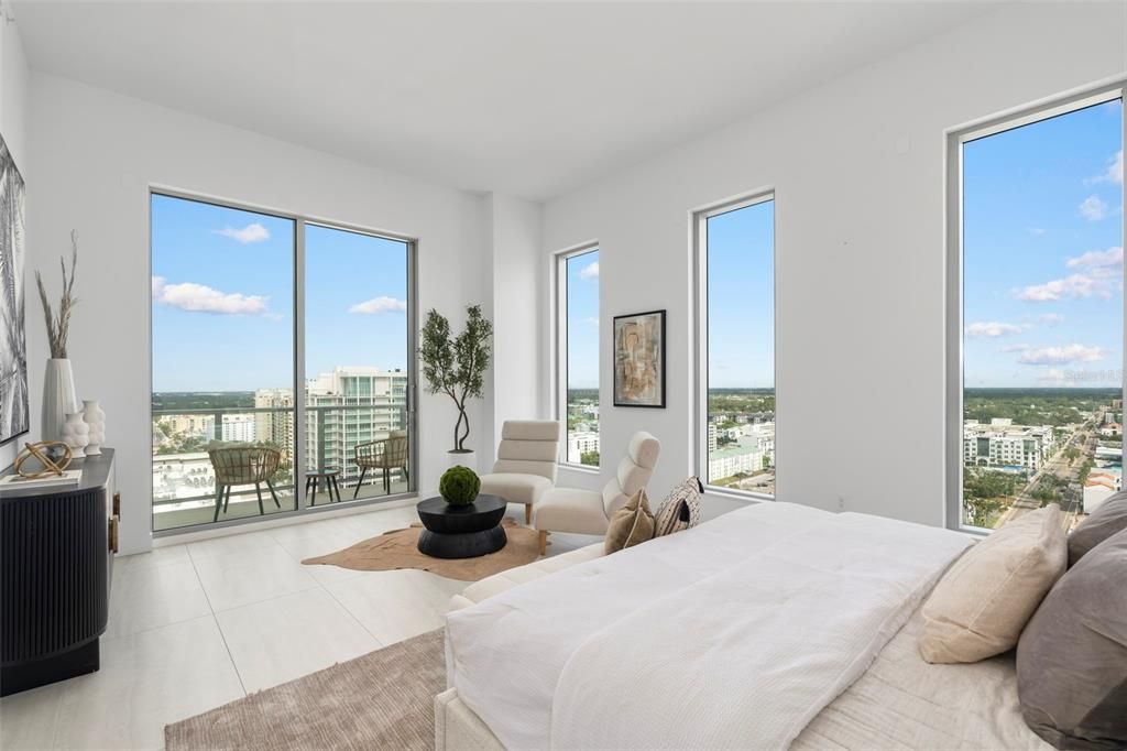 The private terrace features glass railings that seem to disappear into the horizon